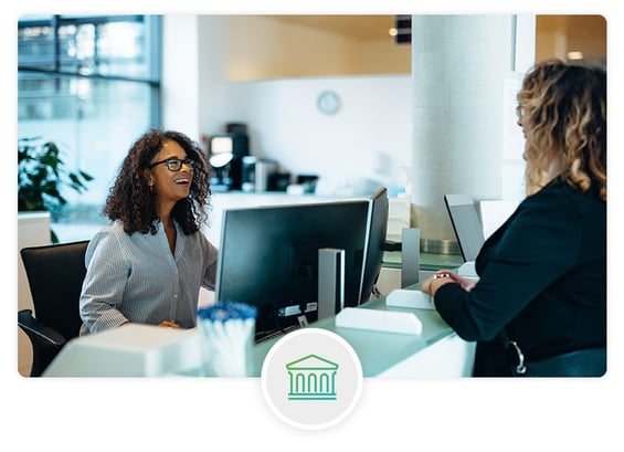 government worker talking with civilian in an office